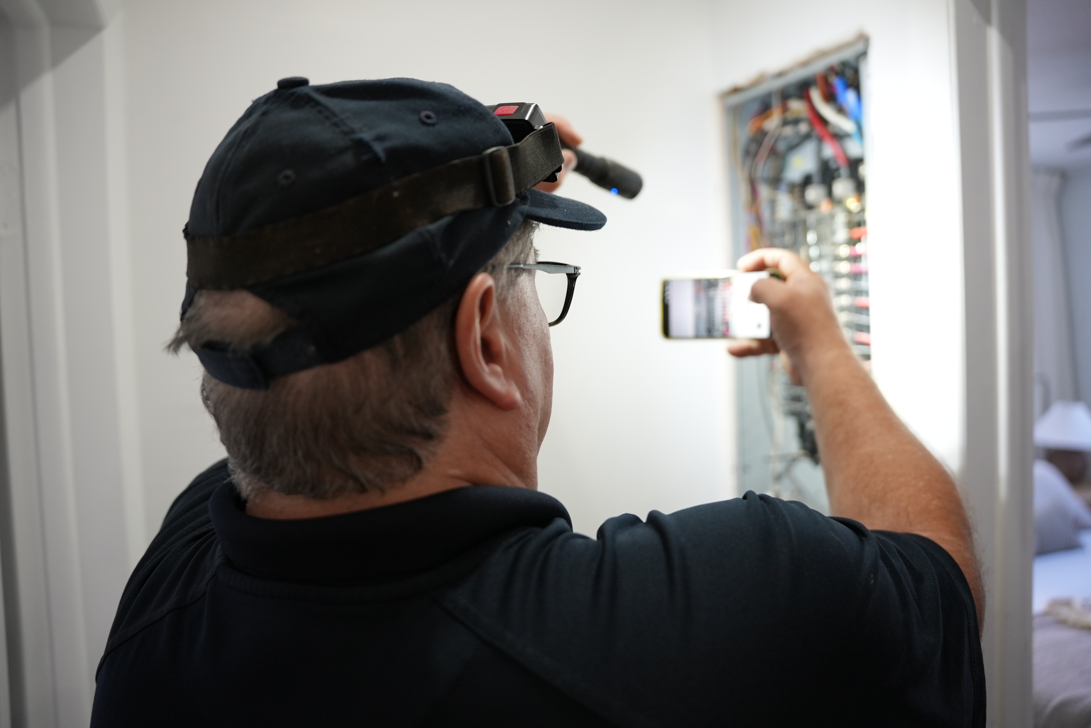 Inspector checking electrical panel